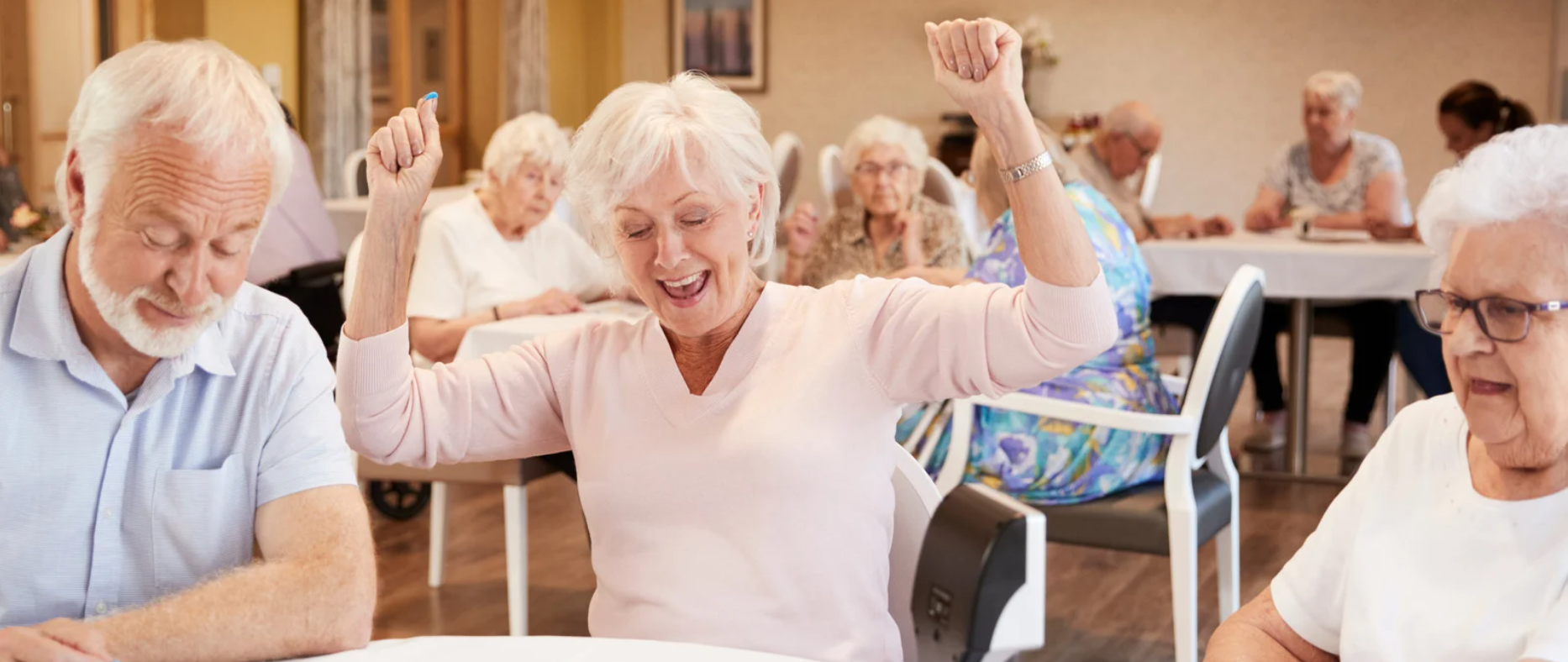 Seniors playing bingo together at an independent living facility